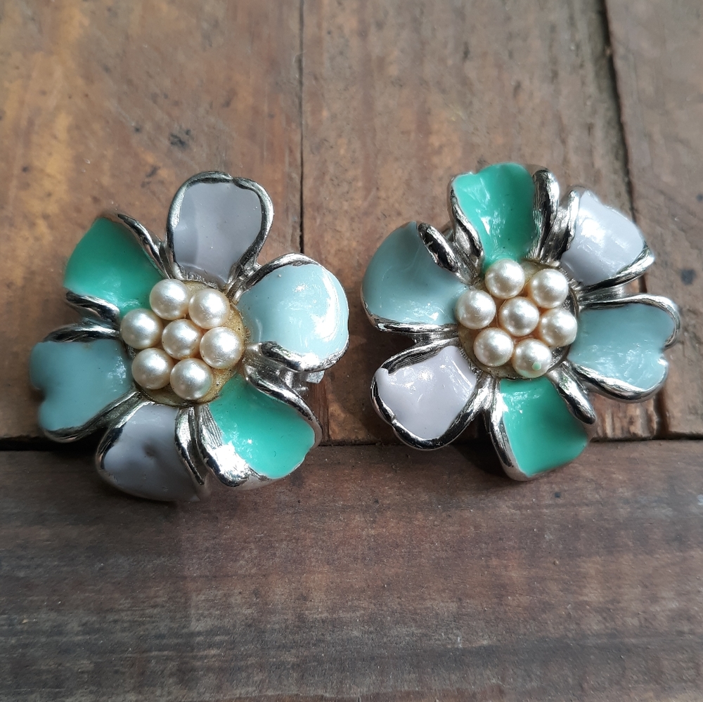 Vintage clip on earrings are green and purple with white pearl centers.